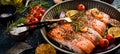 Baked Salmon with rosemary, lemon and vegetables. Recipe. Seafood. Side view