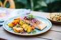 baked salmon with a side of colorful roasted roots