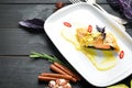 Baked salmon with spinach in dough. In the plate. Royalty Free Stock Photo