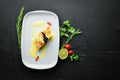 Baked salmon with spinach in dough. In the plate. Royalty Free Stock Photo