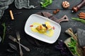 Baked salmon with spinach in dough. In the plate. Royalty Free Stock Photo