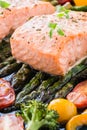 Baked salmon and vegetables on baking tray