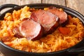 Baked Sauerkraut Podvarak with carrot, onion, smoked pork and bacon closeup in the pan. horizontal Royalty Free Stock Photo