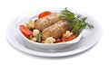 Baked sausage with vegetables in bowl
