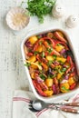 Baked sausage and vegetables, peppers, zucchini, tomatoes, red onion and eggplant with sesame and cilantro served hot from oven Royalty Free Stock Photo