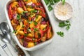 Baked sausage and vegetables, peppers, zucchini, tomatoes, red onion and eggplant with sesame and cilantro served hot from oven Royalty Free Stock Photo