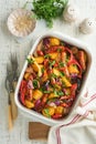 Baked sausage and vegetables, peppers, zucchini, tomatoes, red onion and eggplant with sesame and cilantro served hot from oven Royalty Free Stock Photo