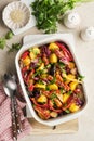 Baked sausage and vegetables, peppers, zucchini, tomatoes, red onion and eggplant with sesame and cilantro served hot from oven Royalty Free Stock Photo