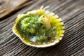 Baked scallop with herb butter