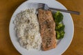Baked season salmon with rice and broccoli