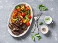 Baked seasonal vegetables - sweet potatoes, broccoli cabbage, sweet peppers, cherry tomatoes, beets, garlic, zucchini and chicken Royalty Free Stock Photo