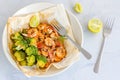Baked Shrimp and Broccoli in a Packet with Lemon Top View, Flat Lay Food Stock Photo