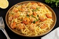 Baked Shrimp Scampi Linguine Pasta with Parsley on a Plate, side view