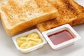 Baked slices of bread with jam and butter Royalty Free Stock Photo