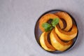 Pumpkin slices with honey. Pumpkin on a plate, top view