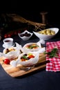 A baked small dumplings with zucchini tomatoes and diced sheep`s cheese Royalty Free Stock Photo