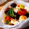 Baked small dumplings with zucchini tomatoes and diced sheep`s cheese Royalty Free Stock Photo