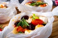 Baked small dumplings with zucchini tomatoes and diced sheep`s cheese Royalty Free Stock Photo