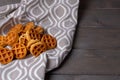 baked small soft waffles on a towel on a wooden table Royalty Free Stock Photo