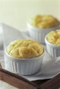 Baked souffle in three white containers on wooden tray Royalty Free Stock Photo