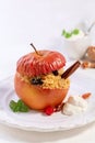 Baked spicy apple with couscous and dried berries