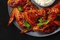 Baked spicy BBQ Chicken Wings smothered in barbecue sauce