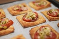 Baked square mini pizzas