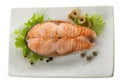 Baked steak of salmon with olives and lettuce