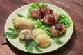 Baked stuffed chicken thighs with potatoes and mushrooms Royalty Free Stock Photo