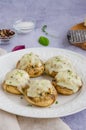Baked Stuffed mushrooms with onion, cream, garlic, thyme and cheese on a white plate. Royalty Free Stock Photo