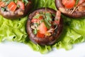 Baked stuffed portobello mushrooms macro. Top view