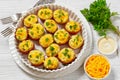 baked stuffed red potato on white baking dish Royalty Free Stock Photo