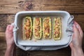 Baked stuffed zucchini boats with minced chicken mushrooms and vegetables with cheese on a baking sheet. Top view Copy space Royalty Free Stock Photo