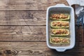 Baked stuffed zucchini boats with minced chicken mushrooms and vegetables with cheese on a baking sheet. Top view Copy space Royalty Free Stock Photo