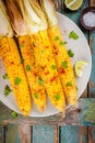 Baked sweet corn cobs with herb butter and lime Royalty Free Stock Photo