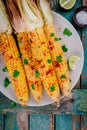 Baked sweet corn cobs with herb butter and lime Royalty Free Stock Photo