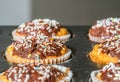 Baked sweet decorated homemade muffins with chocolate topping