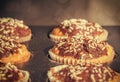 Baked sweet decorated homemade muffins in retro colors