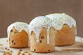 Baked sweet dessert traditional easter cake panettone also called kulich glazed with icing and raisins on vintage textile