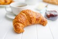 Baked tasty croissant on white table Royalty Free Stock Photo