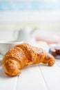 Baked tasty croissant on white table Royalty Free Stock Photo