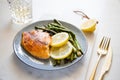 Baked tilapia fish with asparagus on a ceramic plate. Royalty Free Stock Photo