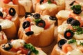 Baked toasts with mozarella, tomatoes, olives and garlic.