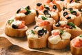 Baked toasts with mozarella, tomatoes, olives and garlic.