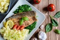 Baked trout fillet with mashed potatoes and steamed spinach Royalty Free Stock Photo