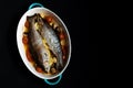 Baked trout with mushrooms, tomatoes and vegetables. Royalty Free Stock Photo