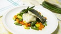 Baked turbot with vegetables. Traditional northern Spanish recipe. Royalty Free Stock Photo