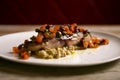 Baked turbot with vegetables. Traditional northern Spanish recipe. Royalty Free Stock Photo