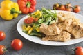 Baked turkey breast, whole wheat fusilli pasta and salad with cherry tomato, bell pepper, cucumber and arugula leaves Royalty Free Stock Photo