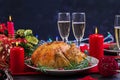 Baked turkey. Christmas dinner. The Christmas table is served with a turkey, decorated with bright tinsel and candles. Fried Royalty Free Stock Photo